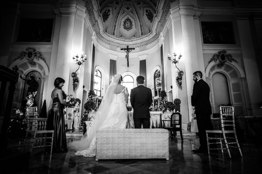 bride and groom at church altar